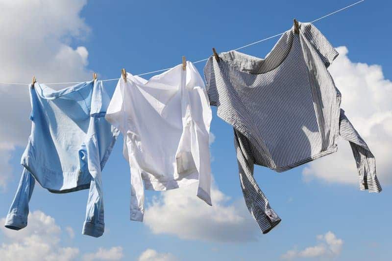 Clean,clothes,hanging,on,washing,line,against,sky.,drying,laundry