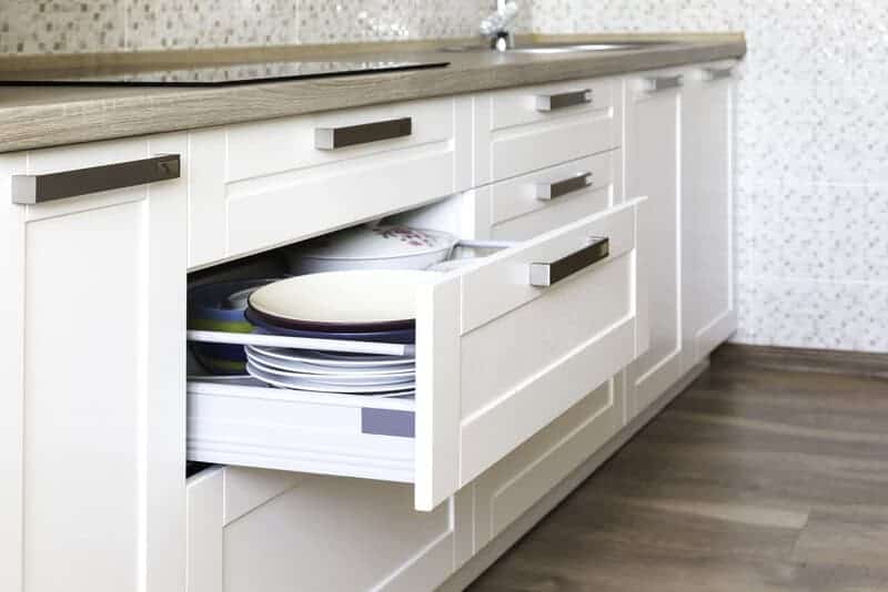 Opened,kitchen,drawer,with,plates,inside,,a,smart,solution,for