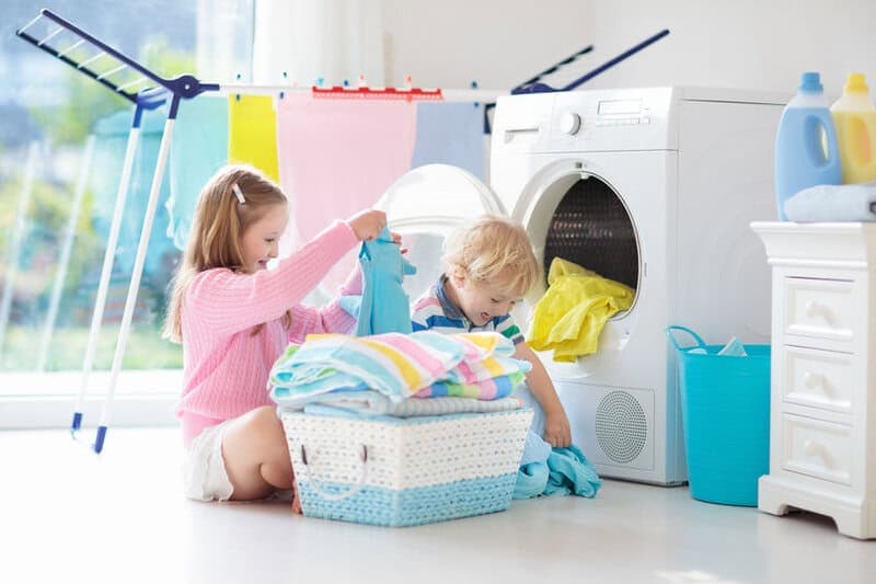Kids In Laundry Room With Washing Machine