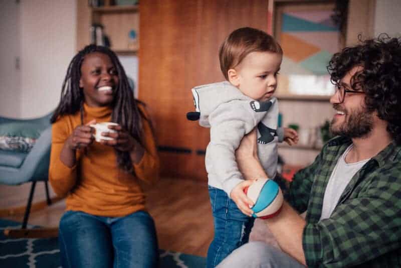 Foster Parents Playing With Baby