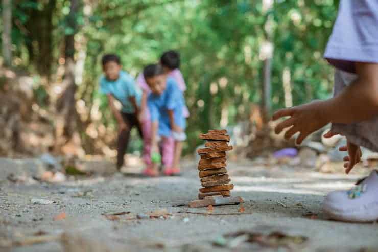 Kid Hand Playing Traditional Stacking Game