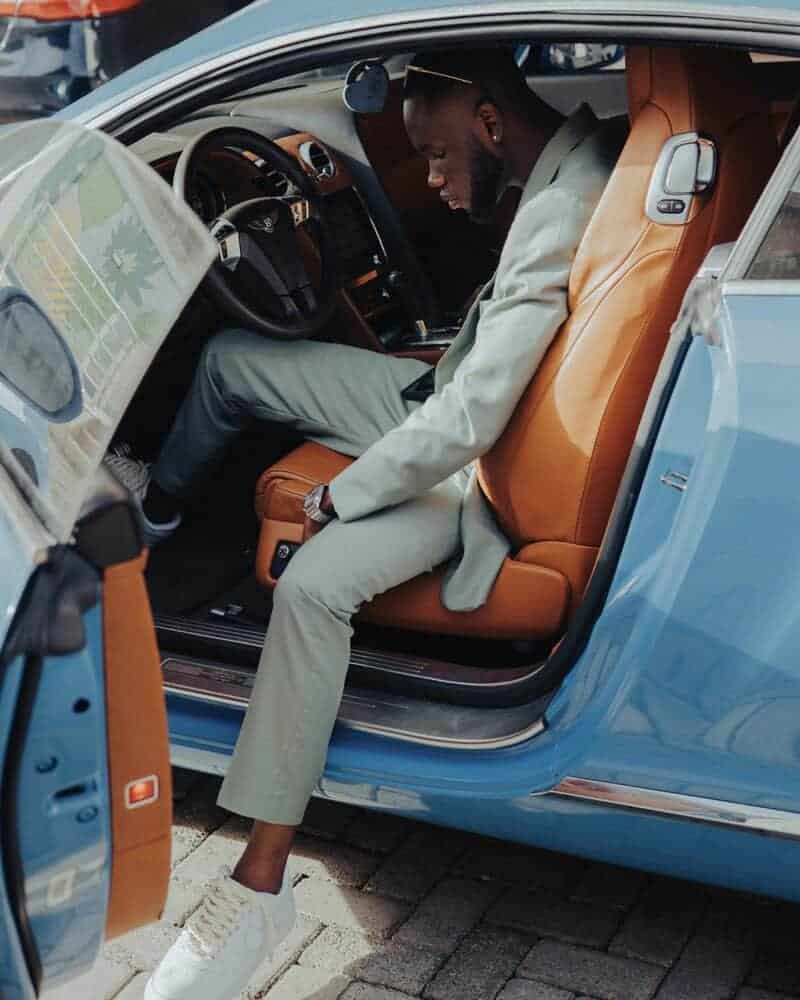 Billionaire steps out of a modest, well loved used car