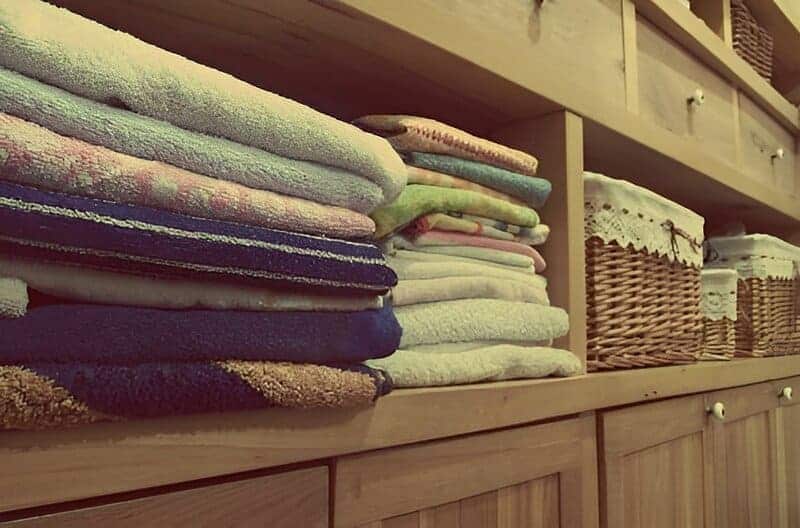 Linen closet filled with soft bedding