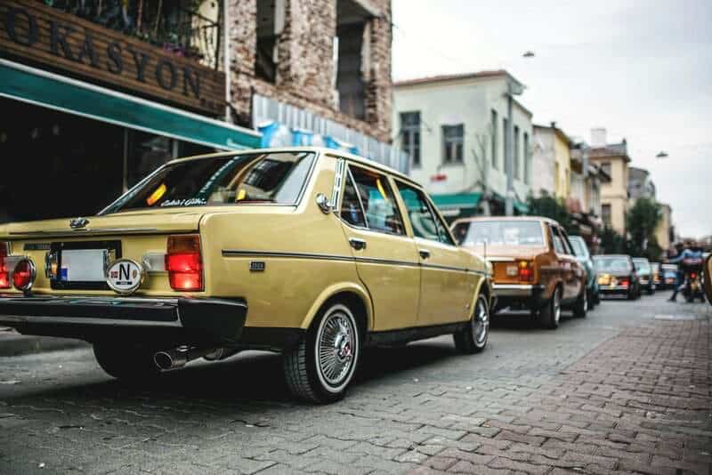 a yellow car parked on the side of the road